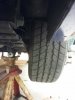 Rear underneath Passenger side one inch clearance between tire and Spring.jpg
